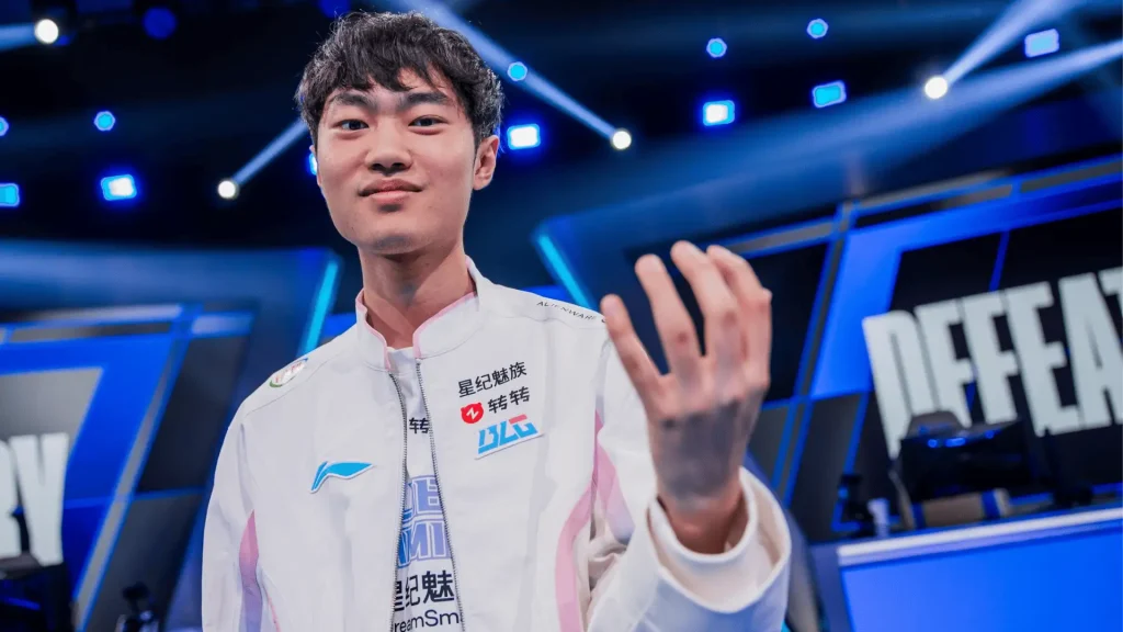 LPL player on stage in team jacket, esports lighting, confident pose, Defeat sign in background