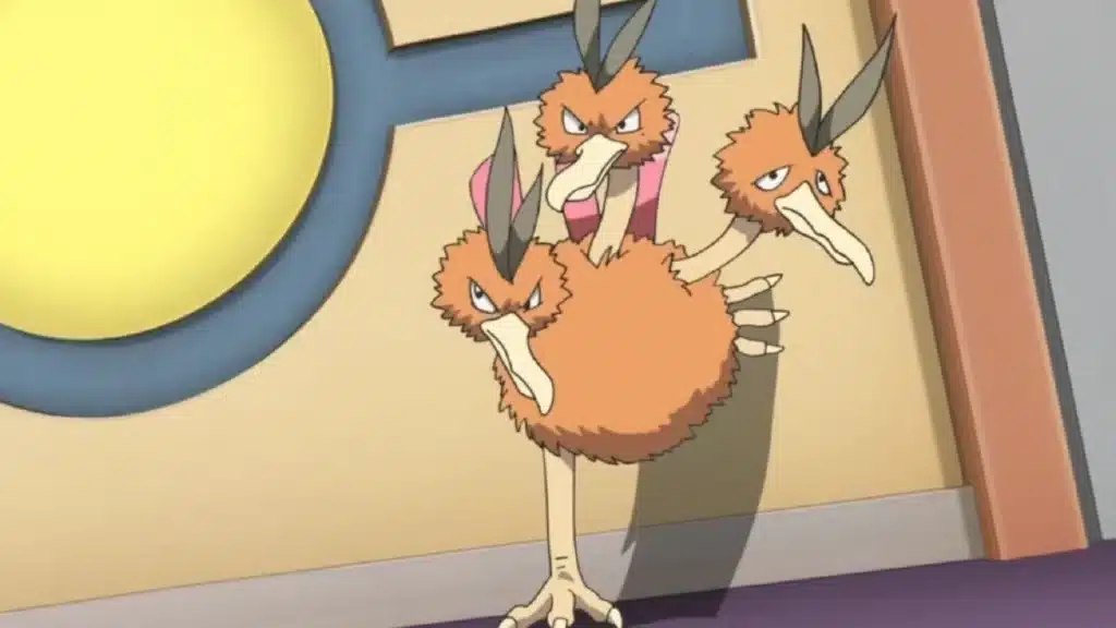 Dodrio standing with three heads showing different expressions, its brown body and long legs visible indoors
