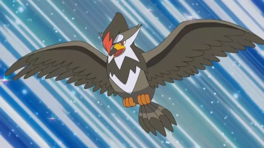 Staraptor flying forward with wings spread wide, showing its sharp gaze against a streaked sky background