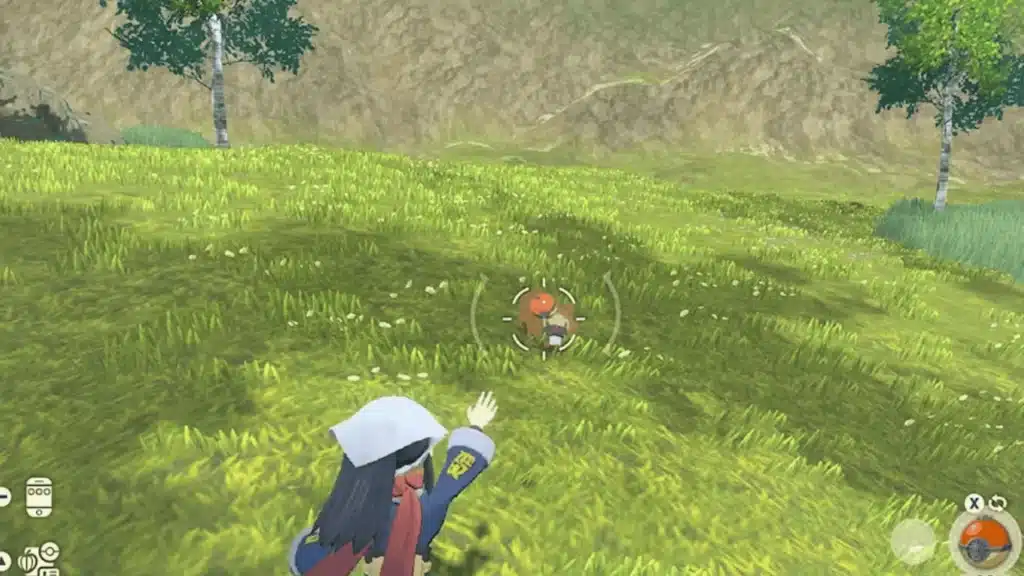 Pokemon Legends Arceus gameplay showing player aiming to catch a wild Pokemon in an open field
