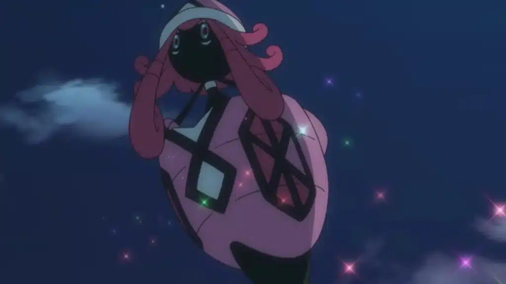 Tapu Lele floating in the night sky with glowing sparkles, showing its Psychic and Fairy type aur